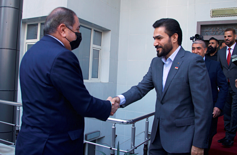  Hassan Al-Adari, head of the political body of the Sadrist bloc, meets with Hoshyar Zebari, head of the Kurdish delegation, for negotiations on forming the new government after the parliamentary elections, in Baghdad, Iraq, November 5, 2021. (credit: POOL VIA REUTERS)