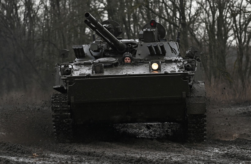  A Russian service member drives a BMP-3 infantry fighting vehicle during drills held by the armed forces of the Southern Military District at the Kadamovsky range in the Rostov region, Russia February 3, 2022. (credit: REUTERS/SERGEY PIVOVAROV)