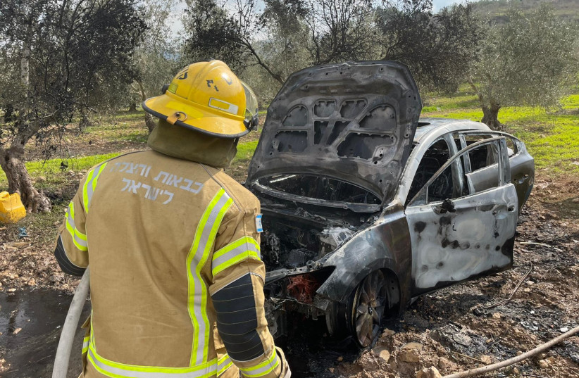  Firefighters hose down a car that was caught on fire in Kafr Kanna February 15, 2022. (photo credit: NORTHERN DISTRICT FIRE AND RESCUE SERVICES)