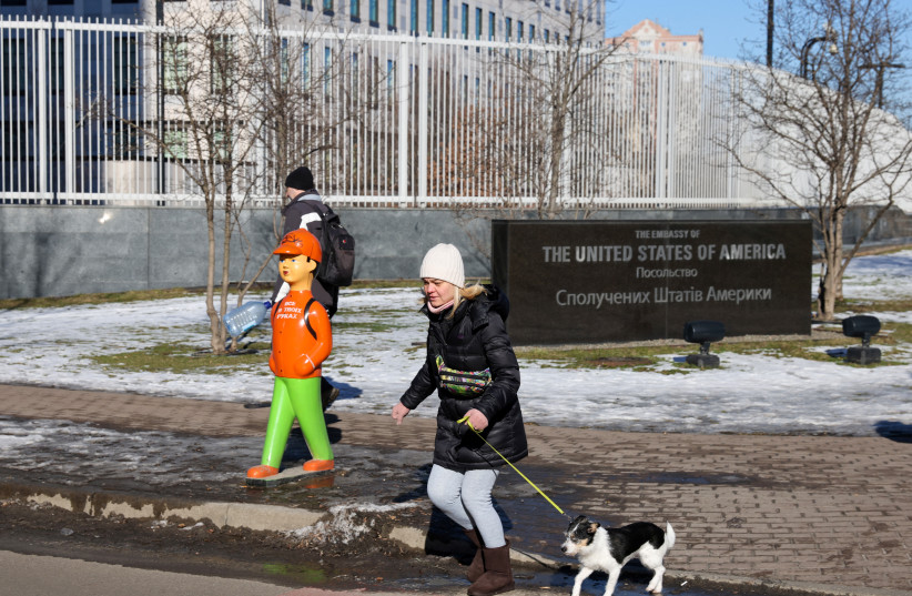  Residents walk along the US Embassy building in Kyiv, Ukraine, February 15, 2022 (credit: REUTERS/UMIT BEKTAS)