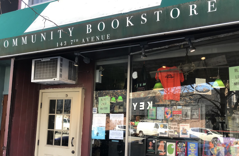  The display at Community Bookstore in Brooklyn window ''offers a gauge of how the neighborhood is thinking and feeling at any given moment,'' said writer and patron Tim Mohr.  (credit: JULIA GERGELY/JTA)
