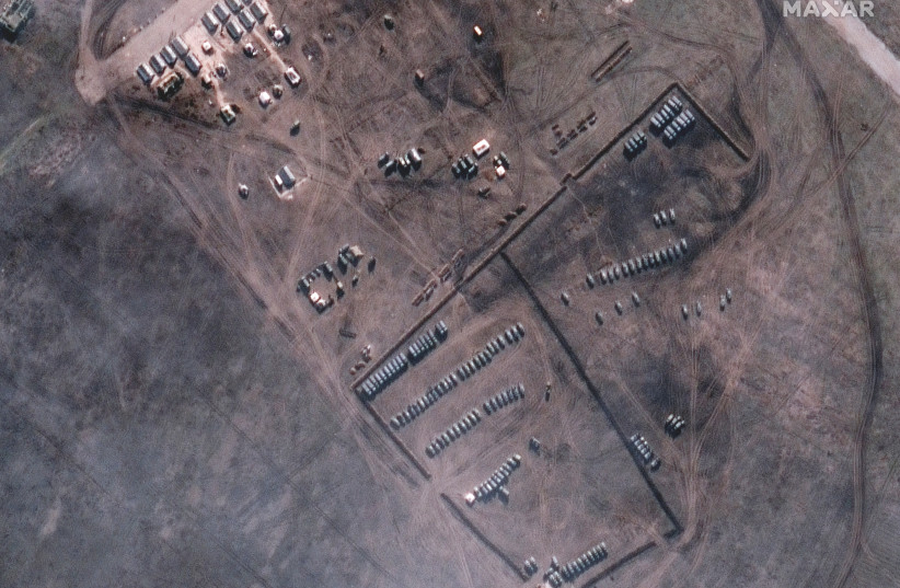  A satellite image shows a new military deployment and armoured vehicles in Slavne, Crimea February 9, 2022.  (credit: MAXAR TECHNOLOGIES/HANDOUT VIA REUTERS)