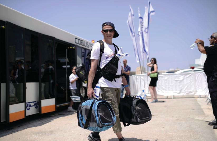 A NEW immigrant arrives at Ben-Gurion Airport. (photo credit: TOMER NEUBERG/FLASH90)