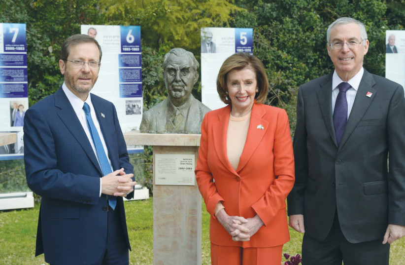  THE HERZOG brothers – President Isaac and Ambassador Mike – pose with Nancy Pelosi in front of a bust of their father, president Chaim Herzog. (credit: AMOS BEN GERSHOM/GPO)