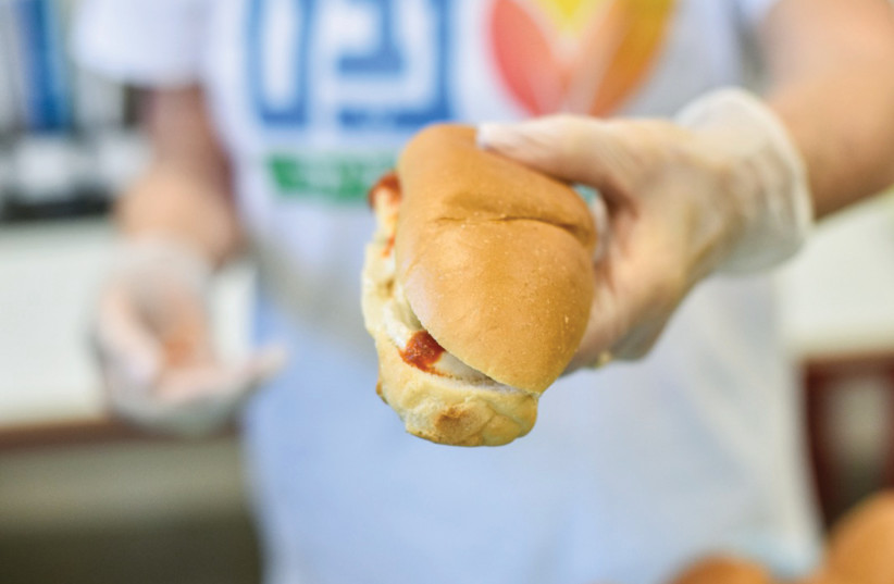  NEVET, AN Israeli nonprofit, provides over 10,000 healthy, fresh sandwiches daily to students who need them (Illustrative).  (photo credit: OMRI SHAPIRA)