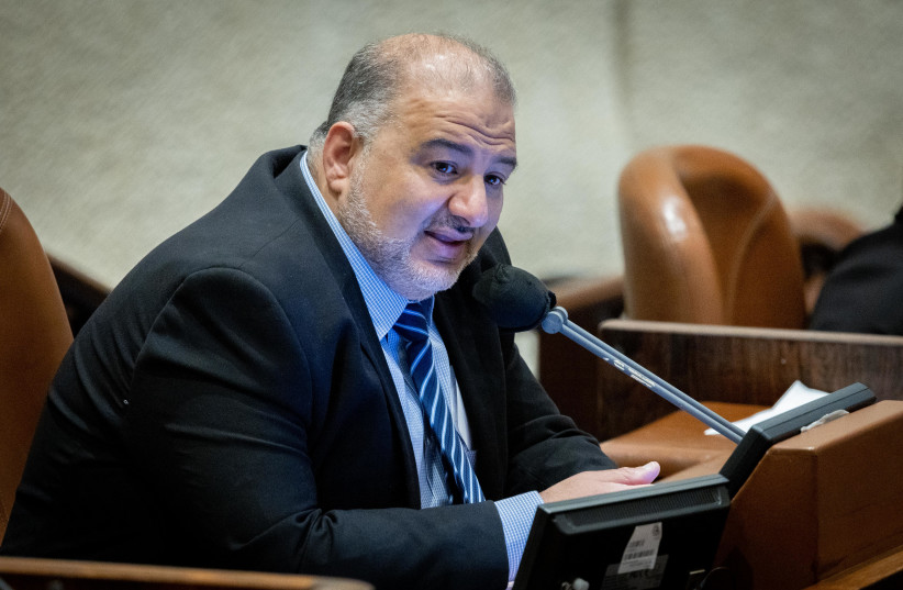  MK Mansour Abbas during a discussion on the Electricity Law connecting to Arab and Bedouin towns, during a plenum session in the assembly hall of the Israeli parliament in Jerusalem, January 5, 2022. (photo credit: YONATAN SINDEL/FLASH90)