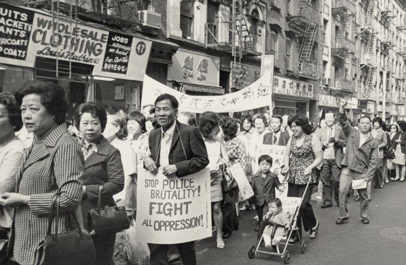  A 1975 protest against police brutality after Peter Yew, a member of the Chinatown community, was killed by the police. (credit: EMILE BOCIAN, COURTESY OF THE MUSEUM OF CHINESE IN AMERICA)