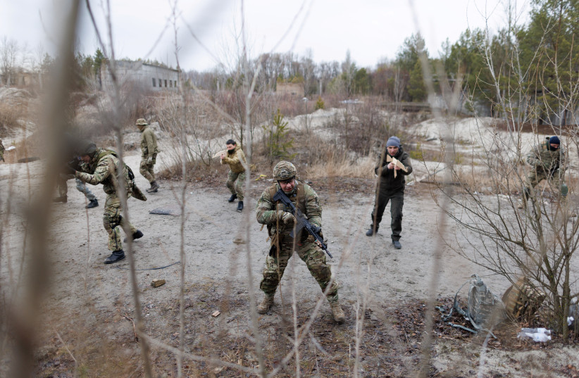 Reservists take part in a tactical training and individual combat skills conducted by the Territorial Defense of the Capital in Kyiv, Ukraine, February 19, 2022. (credit: REUTERS/ANTONIO BRONIC)