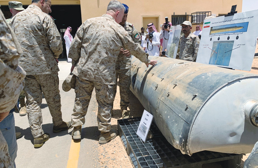  SAUDI ARABIAN-led coalition officials show US Central Command chief General Kenneth McKenzie an exhibit of missiles and other weapons said to be used in Houthi attacks against Saudi Arabia, in Riyadh in 2019. (photo credit: REUTERS/MARWA RASHAD)