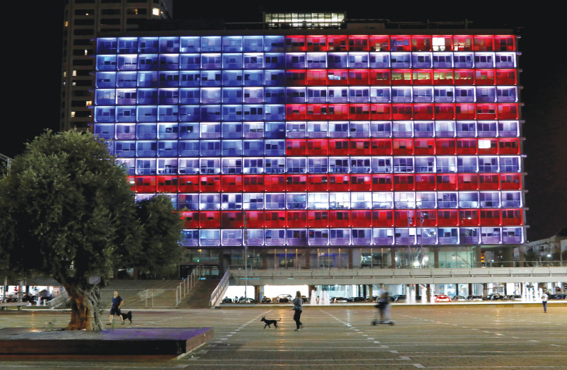  THE TEL AVIV municipality building is lit in the colors of the American flag in solidarity with the victims of the Pittsburgh synagogue attack in October 2018. (photo credit: NIR ELIAS/REUTERS)