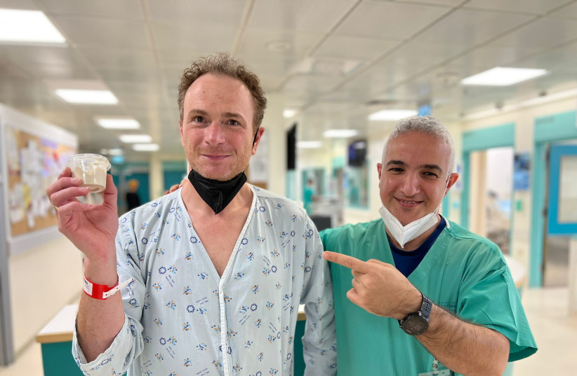  Walter Spielmann and Dr. Elad Asher at Share Zedek holding a container of techina that Walter now knows never to consume again. (credit: SHAARE ZEDEK MEDICAL CENTER)