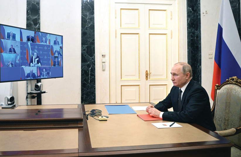 PRESIDENT VLADIMIR Putin meets with members of the Russian Security Council via a video link on Friday.  (photo credit: Sputnik/Kremlin/Reuters)
