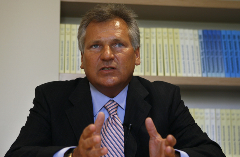  Former Polish President Aleksander Kwasniewski speaks to Reuters during an interview at his office in Warsaw. (photo credit: REUTERS/PETER ANDREWS)