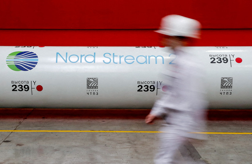  The logo of the Nord Stream 2 gas pipeline project is seen on a pipe at the Chelyabinsk pipe-rolling plant in Chelyabinsk, Russia, February 26, 2020 (photo credit: MAXIM SHEMETOV/REUTERS)