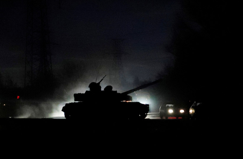  A tank drives along a street after Russian President Vladimir Putin ordered the deployment of Russian troops to two breakaway regions in eastern Ukraine following the recognition of their independence, in the separatist-controlled city of Donetsk, Ukraine February 22, 2022. (photo credit: REUTERS/ALEXANDER ERMOCHENKO)