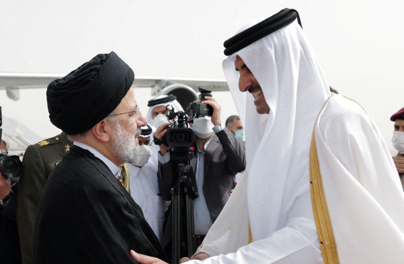 Qatar's Emir Sheikh Tamim bin Hamad Al-Thani receives Iran's President Ebrahim Raisi, in Doha, Qatar, February 21, 2022. (credit: QATAR NEWS AGENCY/HANDOUT VIA REUTERS)