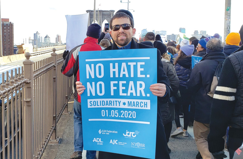  THE WRITER participates in a march on the Brooklyn Bridge in January 2020, which was organized in response to rising antisemitism in New York and New Jersey. (photo credit: Rabbi Elchanan Poupko)