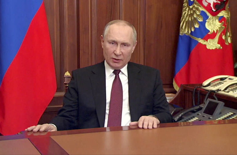  Russian President Vladimir Putin delivers a video address announcing the start of the military operation in eastern Ukraine, in Moscow, Russia, in a still image taken from video footage released February 24, 2022. (credit: Russian Pool/Reuters TV via REUTERS ATTENTION EDITORS)