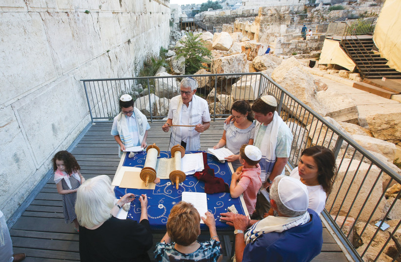  An American family celebrates a bar mitzvah at Robinson's Arch, where egalitarian prayers take place at the Western Wall. (credit: MARC ISRAEL SELLEM)
