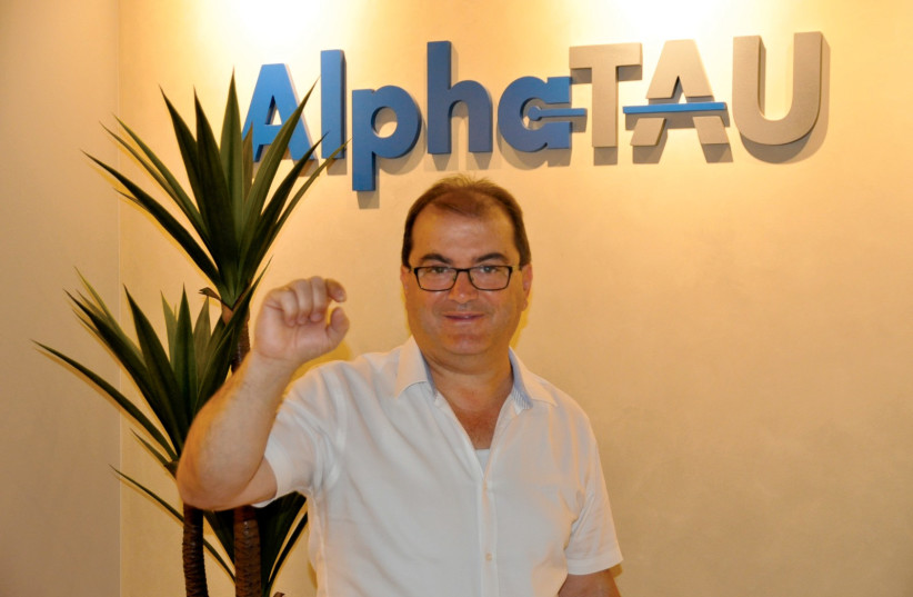  Alpha Tau Medical EO and Chairman Uzi Sofer holding the Alpha DaRT vial. (photo credit: ALPHA TAU MEDICAL)