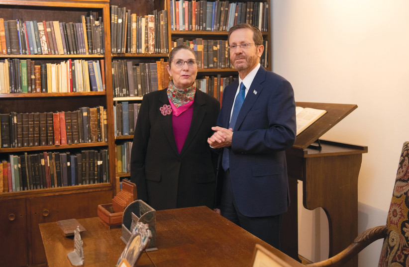  PRESIDENT ISAAC HERZOG and wife Michal in the study of his late grandfather, chief rabbi Yitzhak Halevi Herzog, at the Museum of Jewish Art at Heichal Shlomo. (photo credit: SRAYA DIAMANT)