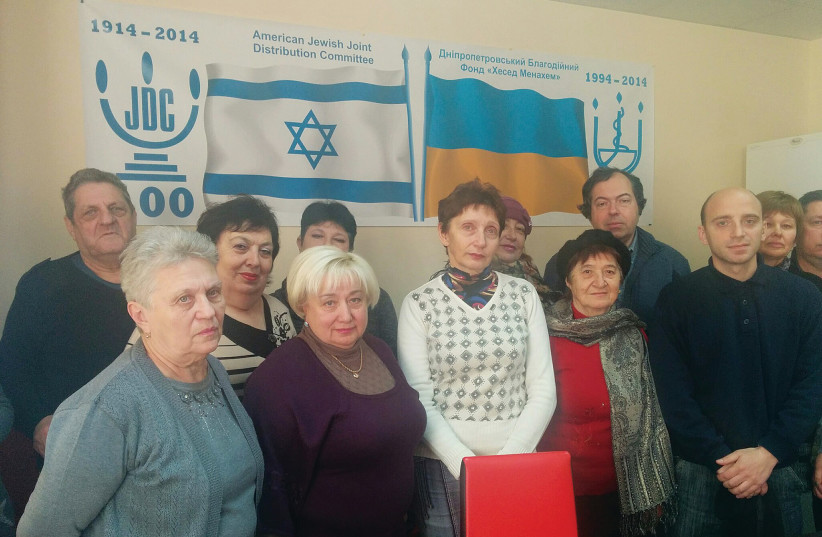  MEMBERS OF THE Dnipro, Ukraine Jewish community in 2015 receiving help from the JDC. (photo credit: Zvika Klein)
