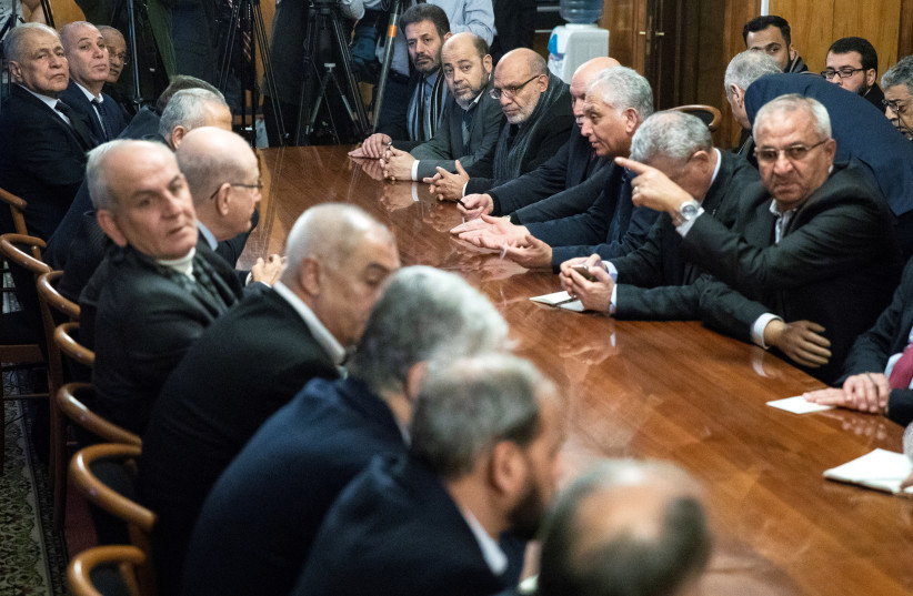  Fatah and Hamas officials wait for a meeting with Russian Foreign Minister Sergei Lavrov and representatives of Palestinian groups and movements as a part of an intra-Palestinian talks in Moscow, Russia February 12, 2019. (credit: PAVEL GOLOVKIN/POOL VIA REUTERS)