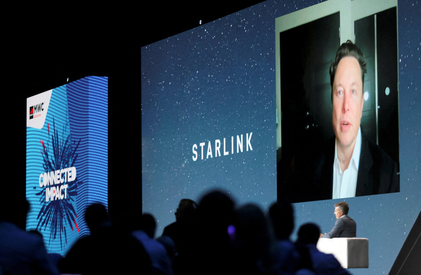  SpaceX founder and Tesla CEO Elon Musk speaks on a screen during the Mobile World Congress (MWC) in Barcelona, Spain, June 29, 2021 (photo credit: NACHO DOCE/REUTERS)