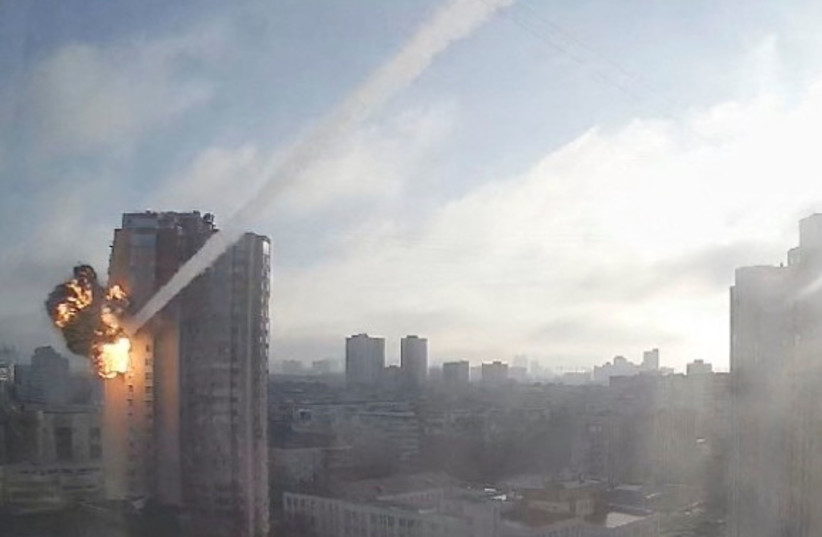 Surveillance footage shows a missile hitting a residential building in Kyiv, Ukraine, February 26, 2022, in this still image taken from a video obtained by REUTERS. (credit: VIA REUTERS)