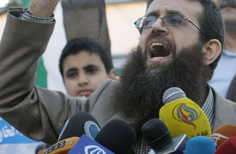  Palestinian Islamic Jihad leader Khader Adnan gestures as he speaks during a rally honoring him following his release, near the West Bank city of Jenin July 12, 2015. (photo credit: ABED OMAR QUSINI/REUTERS)