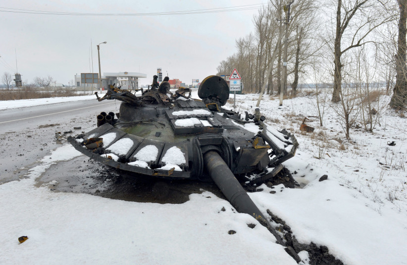  A fragment of a destroyed Russian tank is seen on the roadside on the outskirts of Kharkiv on February 26, 2022, following the Russian invasion of Ukraine. (photo credit: SERGEY BOBOK/AFP via Getty Images)