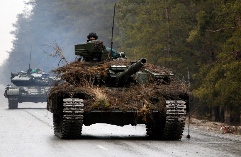  Ukrainian tanks move on a road before an attack in Lugansk region on February 26, 2022.  (photo credit:  ANATOLII STEPANOV/AFP via Getty Images)
