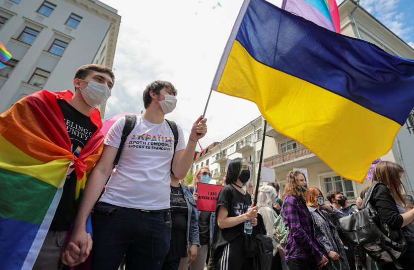 Activists hold a rally demanding state support for the local LGBTQ+ community outside the presidential office headquarters in Kyiv, Ukraine June 5, 2021 (photo credit: Serhii Nuzhnenko/Reuters)