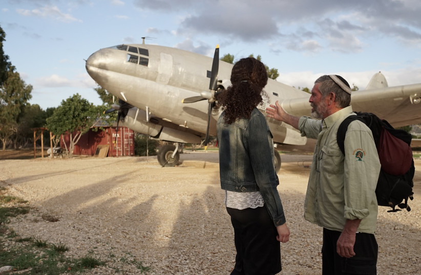 Visitors marvel at a restored C46 airplane that was used to secretly bring Jews from Iraq to Israel in the 1940s (photo credit: JNF-USA)