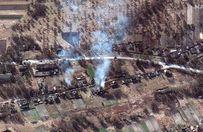  A satellite image shows part of a military convoy and burning homes, near Invankiv, Ukraine February 28, 2022.  (credit: Satellite image 2022 Maxar Technologies/Handout via REUTERS)