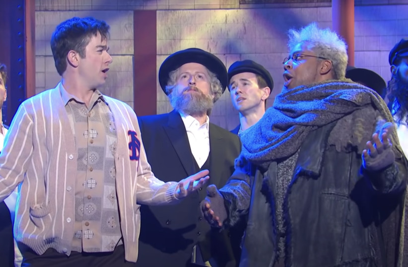  John Mulaney and Kenan Thompson perform a parody of “Fiddler on the Roof” with a chorus line of Hasidic dancers on “Saturday Night Live,” Feb. 26, 2022.  (photo credit: NBC via Youtube)