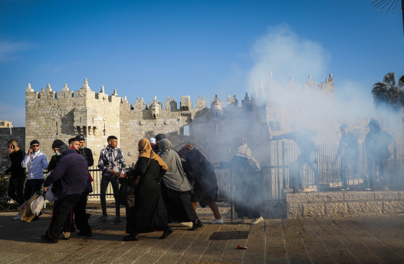  Police clash with Palestinians during a protest at Damascus Gate in Jerusalem Old City on February 28, 2022. (credit: FLASH90)