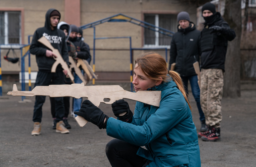  A woman takes part in a basic military training session on February 28, 2022 in Ivano-Frankivsk, Ukraine. (credit: Alexey Furman/Getty Images)