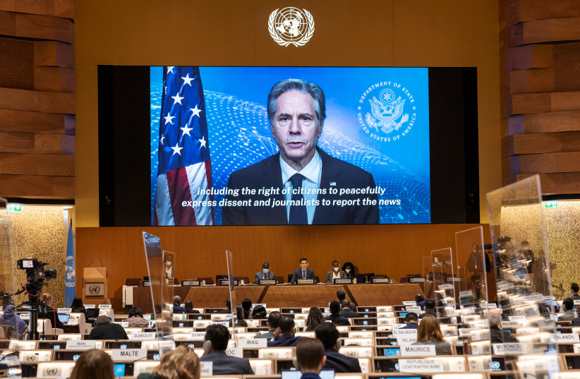 US Secretary of State Antony Blinken appears on a screen as he delivers a speech during the 49th session of the UN Human Rights Council at the European headquarters of the United Nations in Geneva, Switzerland, March 1, 2022. (photo credit: SALVATORE DI NOLFI/POOL VIA REUTERS)