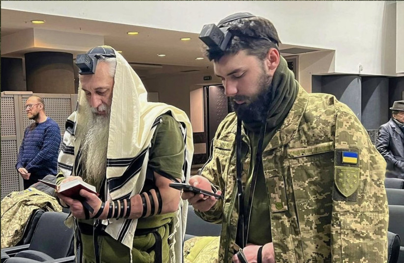  Asher, left, and David Cherkaskyi pray in their Dnipro, Ukraine, synagogue this week. The father and son have enlisted to fight for Ukraine in its war against Russia.  (credit: COURTESY DAVID CHERKASKYI)
