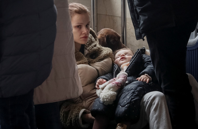  People wait to board an evacuation train from Kyiv to Lviv, at Kyiv central train station, following Russia's invasion of Ukraine, in Kyiv, Ukraine March 2, 2022. (photo credit: REUTERS/GLEB GARANICH)