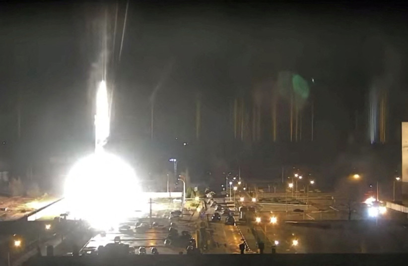  Surveillance camera footage shows a flare landing at the Zaporizhzhia nuclear power plant during shelling in Enerhodar, Zaporizhia Oblast, Ukraine March 4, 2022, in this screengrab from a video obtained from social media (photo credit: ZAPORIZHZHYA NPP VIA YOUTUBE/VIA REUTERS)