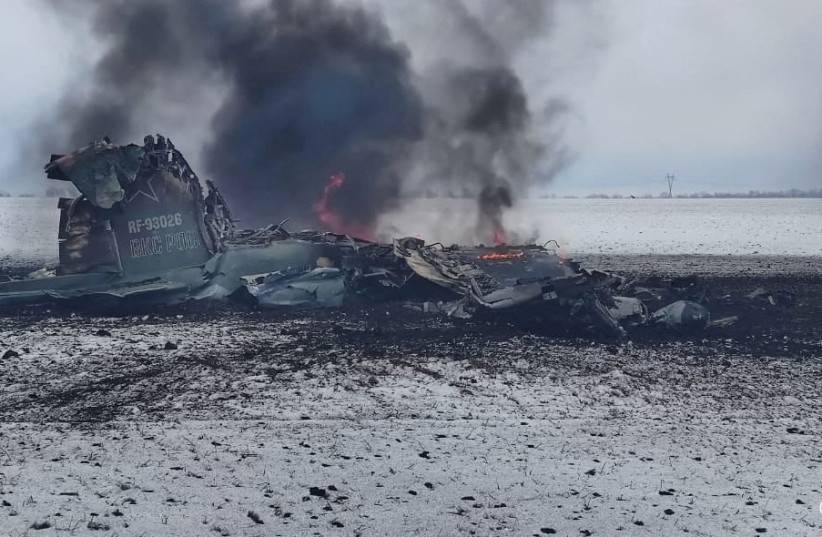  A view shows the wreckage, which Ukrainian military officials said is the remains of a Russian Air Force assault aircraft, amid the Russian invasion of Ukraine, in a field outside the town of Volnovakha in the Donetsk region, Ukraine, in this handout picture released March 4, 2022. (credit: Press service of the Joint Forces Operation/Handout via REUTERS)