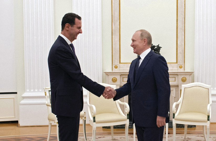  RUSSIAN PRESIDENT Vladimir Putin meets with Syrian President Bashar Assad at the Kremlin over a year ago. The intervention in Syria remains the catalyst that signified the Russian challenge to the US. (photo credit: Sputnik/Kremlin/Reuters)