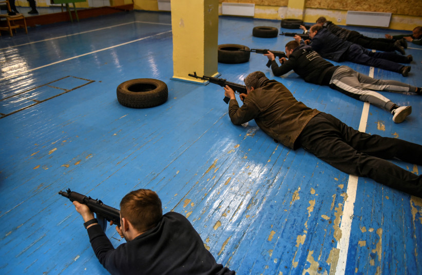  Civilians who volunteered to join the Territorial Defense Forces train on weapons, following Russia's invasion of Ukraine, in Odessa, Ukraine, March 7, 2022. (credit: ALEXANDROS AVRAMIDIS/REUTERS)