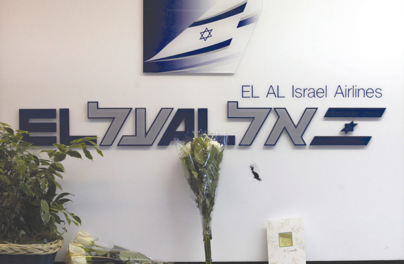  FLOWERS AND a card are placed at El Al’s ticket counter at Los Angeles International Airport in July 2002, after a gunman killed two people and injured several more before an El Al security guard shot him dead. (credit: ADREES LATIF/REUTERS)