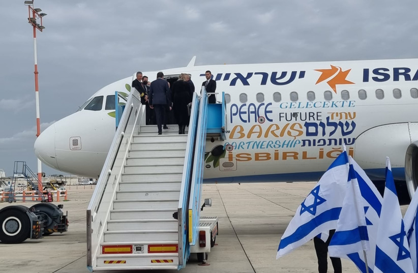 President Isaac Herzog and First Lady Michal Herzog boarding a plane to Turkey ahead of a meeting with president Recep Tayyip Erdogan on March 8, 2022 (photo credit: ANNA RAIBA BARSKY/MAARIV)