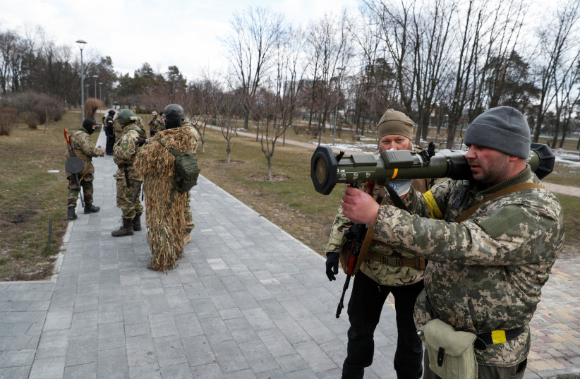  New members of the Territorial Defense Forces train to operate AT4 anti-tank launcher during military exercises amid Russia's invasion of Ukraine, in Kyiv, Ukraine March 9, 2022. (credit: VALENTYN OGIRENKO/REUTERS)