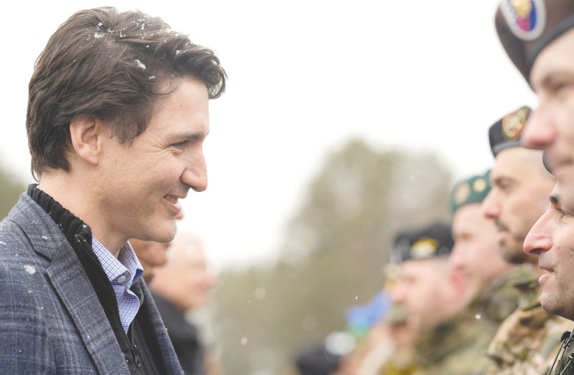  CANADIAN PRIME MINISTER Justin Trudeau meets members of the military as he arrives in Latvia on Tuesday, amid Russia’s invasion of Ukraine. ‘Hell, even the Canadians are being rude!’ (credit: Ints Kalnins/Reuters)
