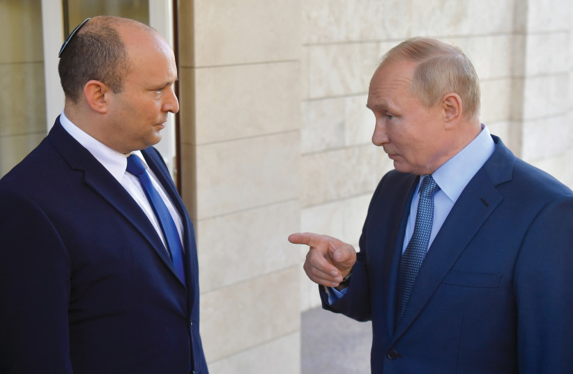  Prime Minister Naftali Bennett at a previous meeting with Russian President Vladimir Putin in Sochi, Russia. (credit: Sputnik/Kremlin/Reuters)